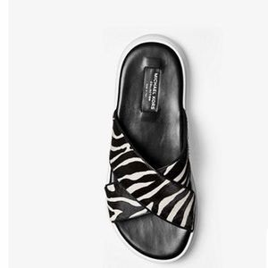 MK Daphne Zebra Calf Hair Slide Sandal
Style# 46T8DAFAIH